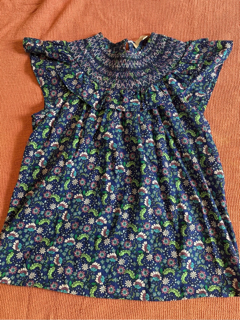 Navy and floral print blouse with smocked neckline by Loft